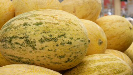 Close-up of a bunch of beautiful ripe melons in a market