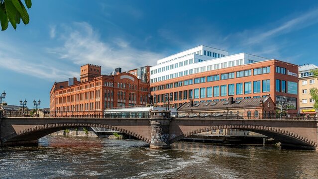 Linkoping university building behind the bridge, Norrkoping, Sweden.