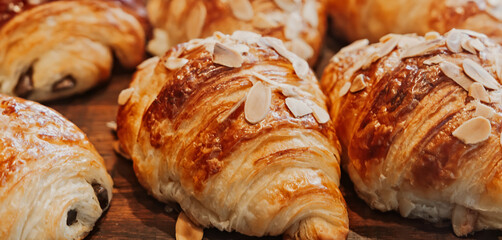Fresh almond and chocolate croissants at a bakery