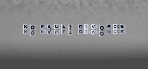 no fault divorce word or concept represented by black and white letter cubes on a grey horizon...