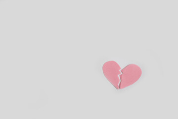 Two pieces of broken heart on white background