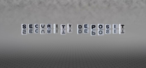 security deposit word or concept represented by black and white letter cubes on a grey horizon background stretching to infinity