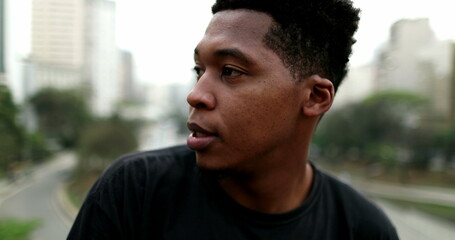 Pensive black African american man in city