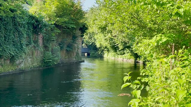 The tranquil Muehlbach downtown Landsberg am Lech, besides the medieval city wall