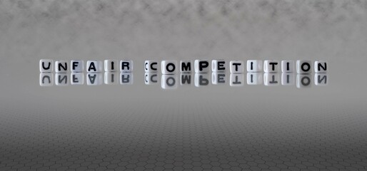 unfair competition word or concept represented by black and white letter cubes on a grey horizon...