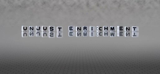 unjust enrichment word or concept represented by black and white letter cubes on a grey horizon background stretching to infinity