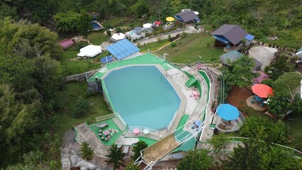 Aerial shot of Dream Cave Mountain Resort with pools and cabanas in Valencia City, Philippines
