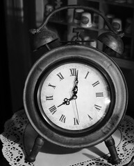 Vertical grayscale of an old vintage alarm clock