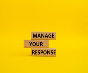 Manage your response symbol. Concept words Manage your response on wooden blocks. Beautiful yellow background. Business and Manage your response concept. Copy space
