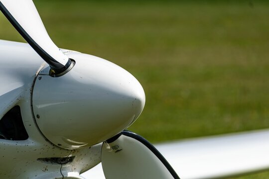 Detail of the propeller cone of a sports aircraft - Powered by Adobe