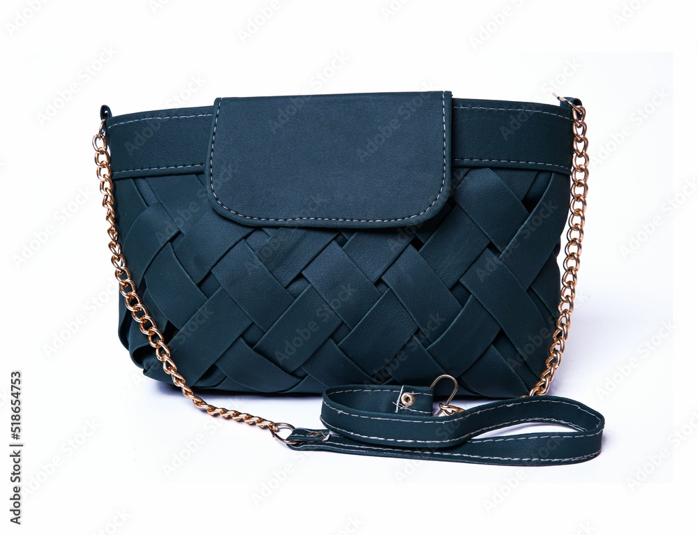 Wall mural women's dark blue leather bag with a flap top, handle, gold chain, front view.