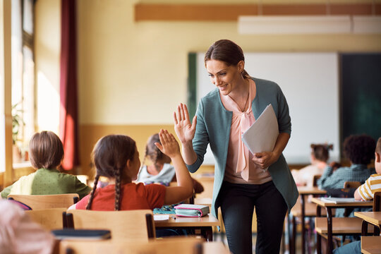 Teacher Posing With Students Stock Photo - Download Image Now - 30