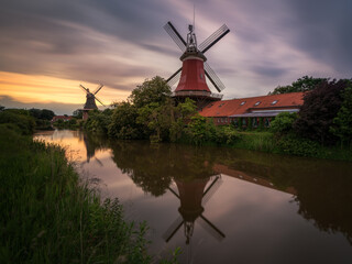 Windmills in greetsiel at sunset