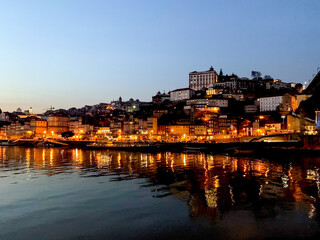 Fototapeta na wymiar Porto, Portugal. Night view of Douro River and Ribeira area. Night view of Douro River in Porto and Vila Nova de Gaia