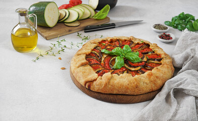 Ratatouille galette pie on light table, ingredients, vegetarian