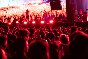 Fototapeta na wymiar crowd partying stage lights live concert summer music festival