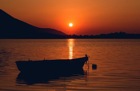 Beautiful shot of a silhouette of a boat at sunset