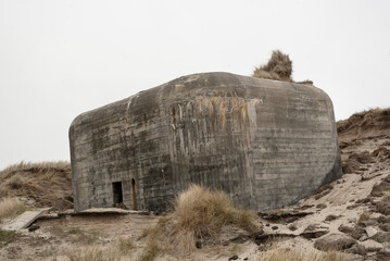 Bunker sinking in the sand on the beach