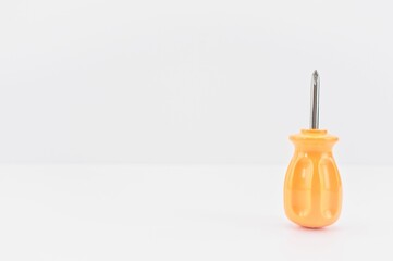 screwdriver isolated on a white table with copy space © Wirestock Creators
