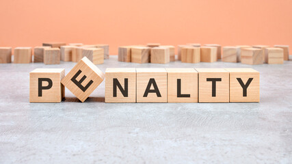 PENALTY word written on wood block. Content text on wooden table for your desing, concept.