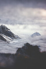 Fototapeta na wymiar Mountain landscape. Mountain tops in fog. Fantasy landscape, mountain rocks. 3D illustration.