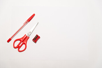 red school equipment on a white table