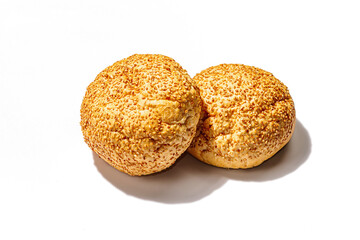 Fresh buns with sesame isolated on a white background. An indispensable ingredient for burgers