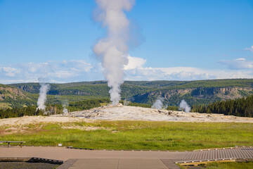 Sunny view of the Old Faithful geyser