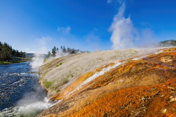 Sunny view of beautiful landscape along Firehole River