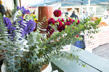 Fototapeta na wymiar Bright and colorful flowers for sale at the Seattle Pike's Market farmer's market outdoors