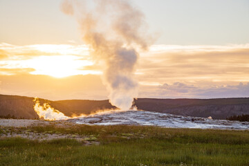 Sunset view of the Old Faithful geyser
