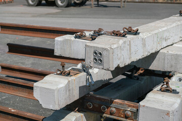 Railway infrastructures: stack of concrete railway sleepers, for railway infrastructures, with load-bearing details and rail support joints.