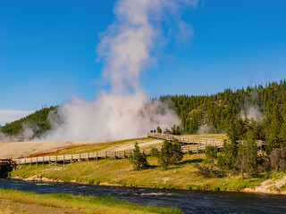 Sunny view of beautiful landscape along Firehole River