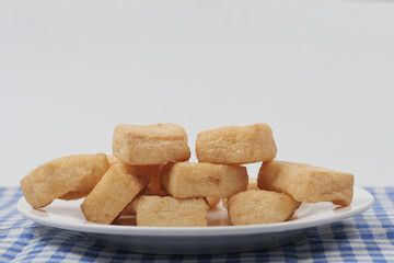 close up of slice of tofu on plate 