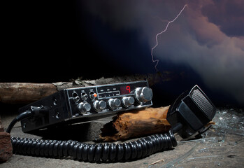 Debris around a ham radio with storm behind