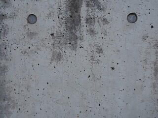 上に丸印が２つある、白色のざらざらしたコンクリートのテクスチャー
