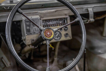 Fototapeta premium Close up of steering wheel in a vintage military general purpose utility vehicle, nobody 