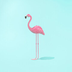 Minimal summer or caribbean concept. .Trendy sunlight Summer composicion made with pink flamingo toy on bright light blue background. Creative art minimal aesthetic.