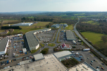 Obraz premium Aerial view of goods warehouses and logistics center in industrial city zone from above