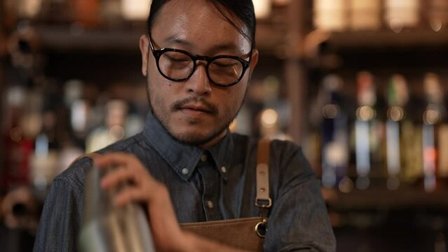 Night club concept of 4k Resolution. A bartender is making drinks for customers in a restaurant. A group of specialized clubs that sell alcoholic beverages.