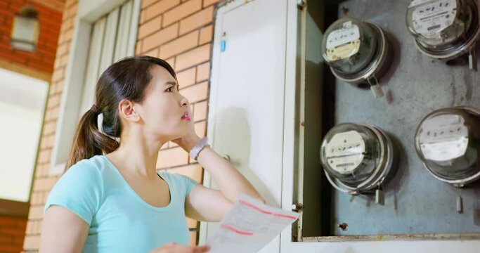 woman and electricity bill