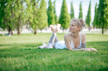 Beautiful girl practice yoga outdoor. Meditation in park