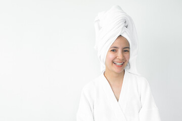 Beautiful Asian woman wearing bathrobe on white background, Face care, Skin care, Facial treatment, Cosmetology, beauty and spa Concept.