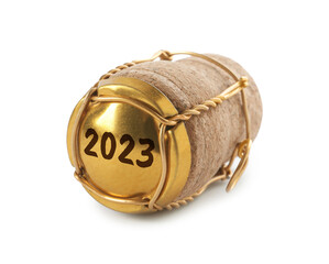 Cork of sparkling wine and muselet cap with engraving 2023 on white background