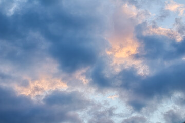 Sky background with sunlight through clouds at sunset