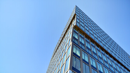 Business office building in the blue sky background. Tall building in the center of the city.