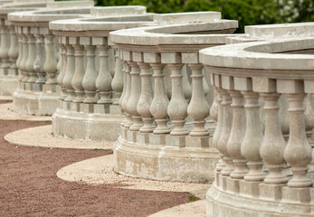 White concrete columns on the fence.