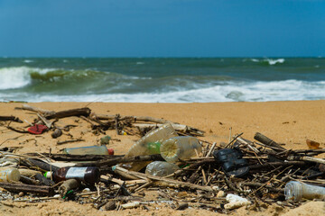Fototapeta na wymiar Discarded plastic debris trash pollution after sea swell storm, environmental nature waste. Negombo, Sri Lanka.