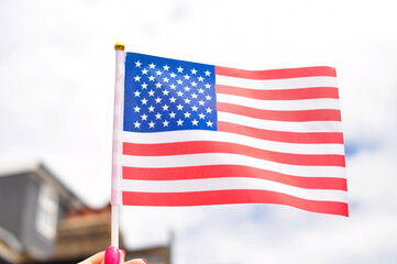 Close up of national flag of USA stripes and stars red and blue colors