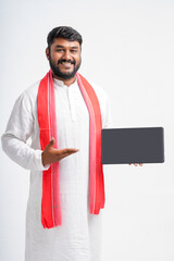 Young indian farmer showing note pad on white background.